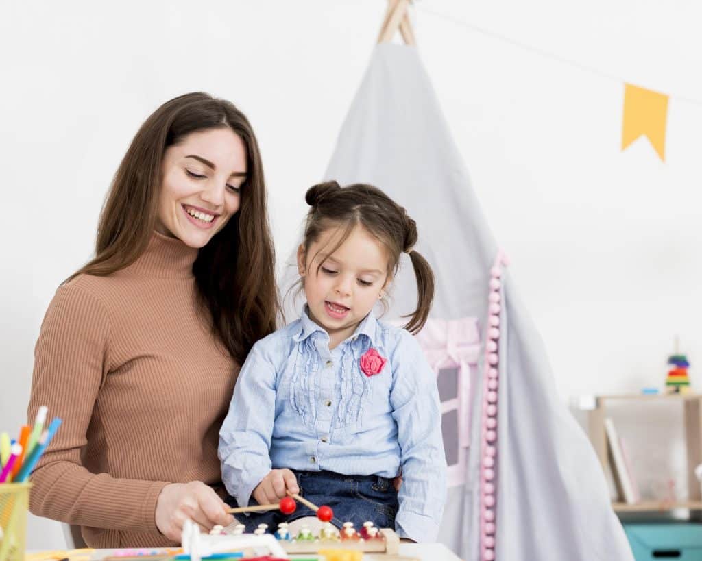 woman playing with young girl home (1)