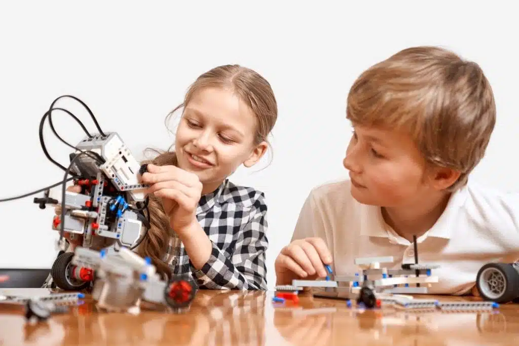 Children building robots and conducting science experiments at Elite University Summer Camp in Houston.