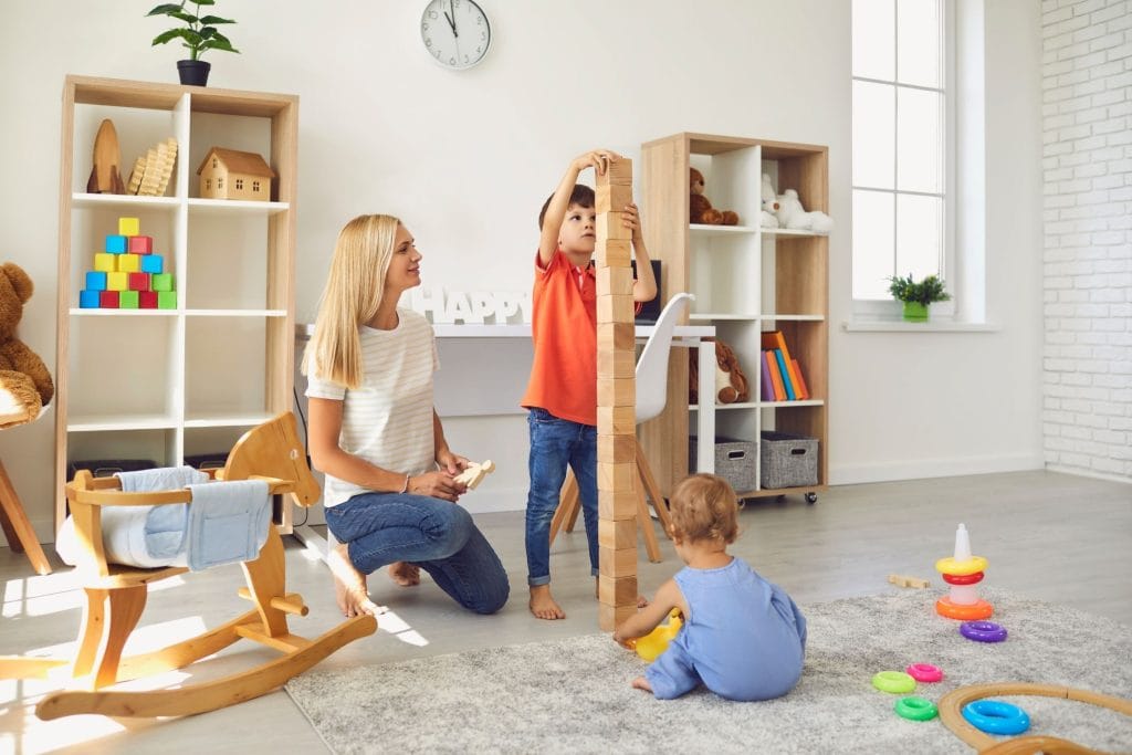 Professional nanny caring for two children at home in Houston