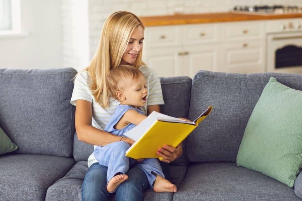 Children listening to a nanny reading a story about kindness and courage
