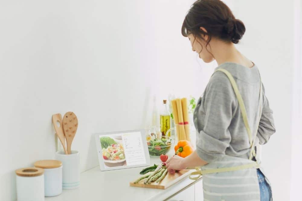 Nanny preparing healthy autumn snacks for children in Texas.