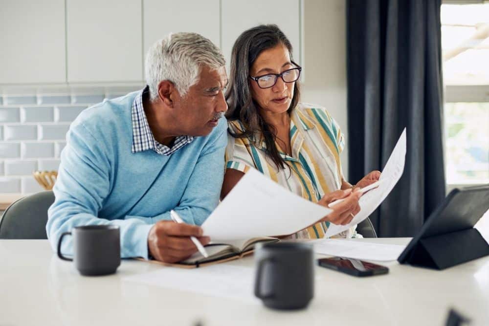 Houston mother reviewing childcare budget and part-time nanny schedule.