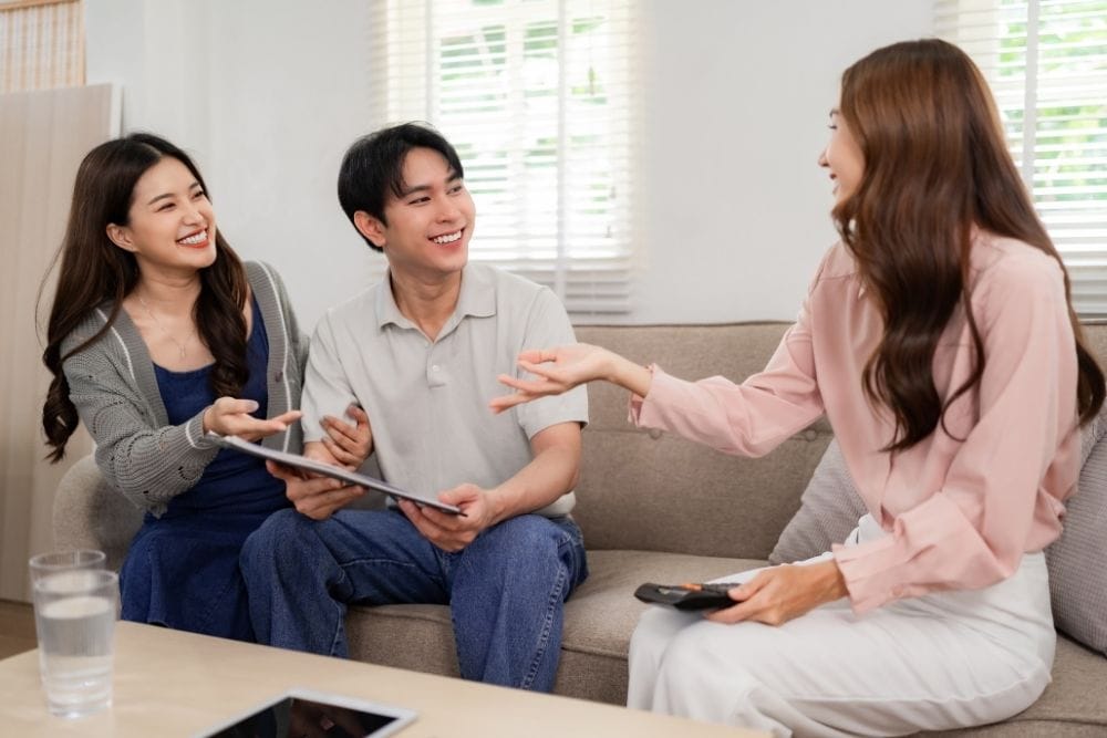 Parents in Houston discussing childcare needs with a professional nanny consultant.