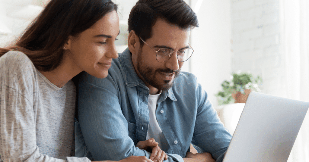 Houston parents reviewing nanny rates and schedules at home with a laptop and notebook