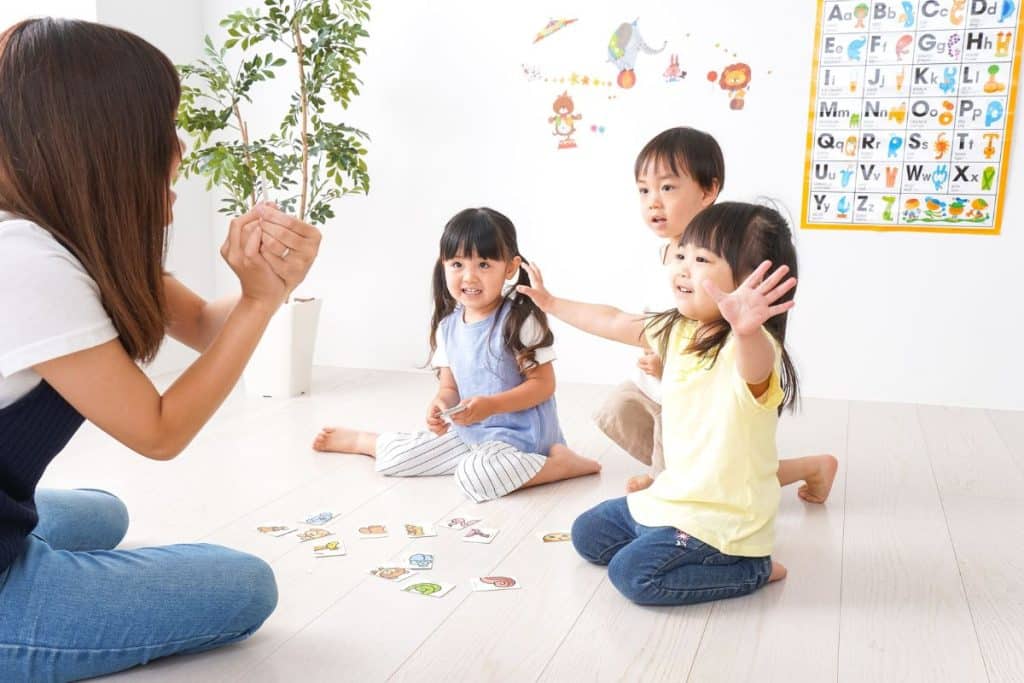 Educated nanny integrating learning into daily routines for children at home.