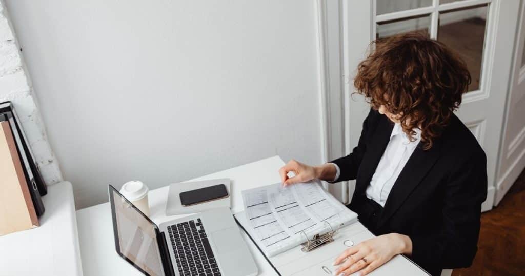 Elite Nanny League placement specialists reviewing nanny applications in Houston office