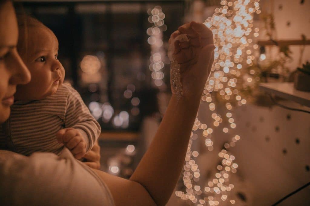 Night nanny providing overnight newborn care so parents can rest during winter.