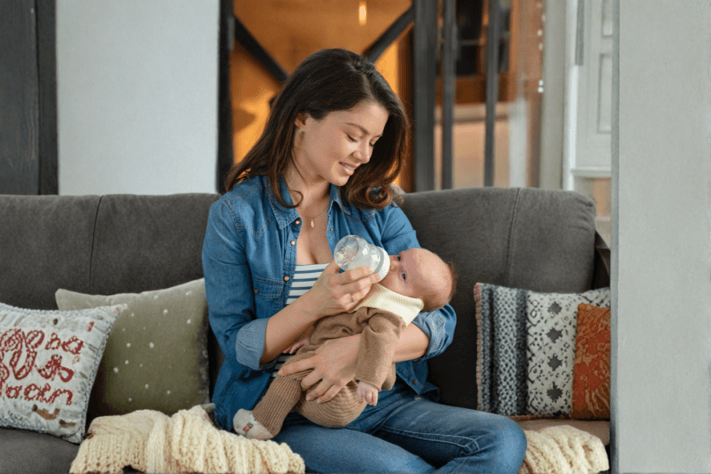 Night nanny and Newborn Care Specialist caring for a newborn in a Houston home during spring season