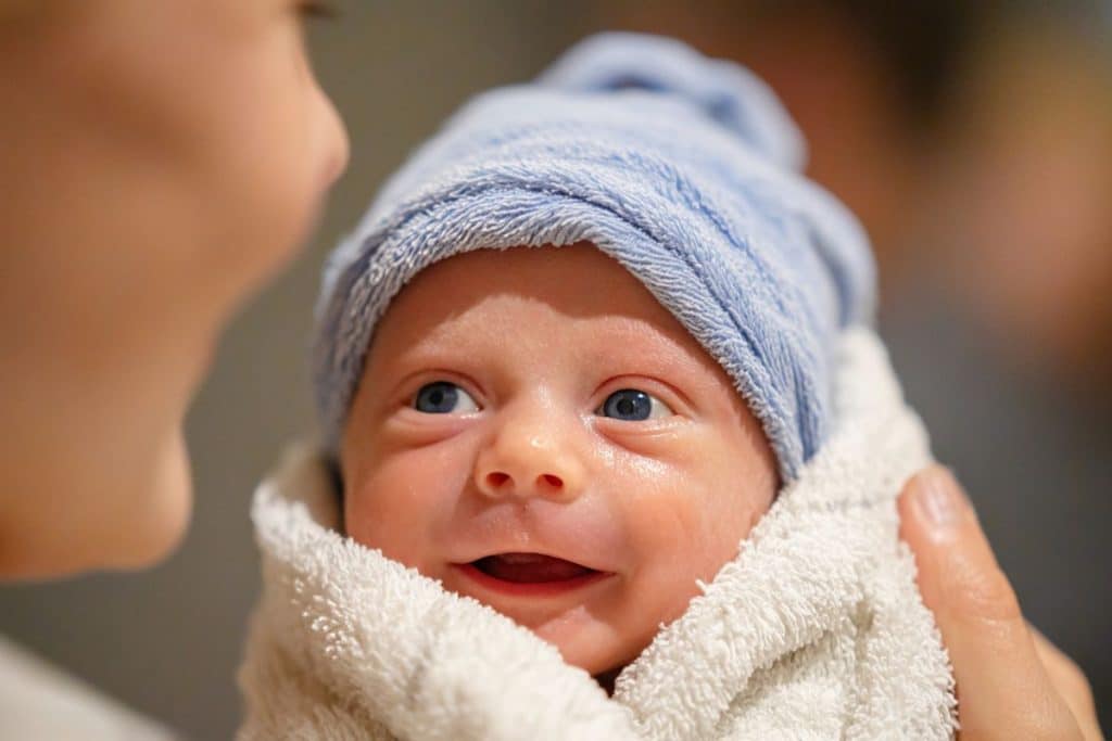 Newborn care specialist reviewing feeding and sleep plans at the start of an overnight shift