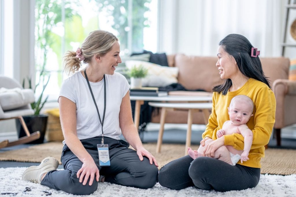 Professional newborn care support helping parents rest and recover postpartum