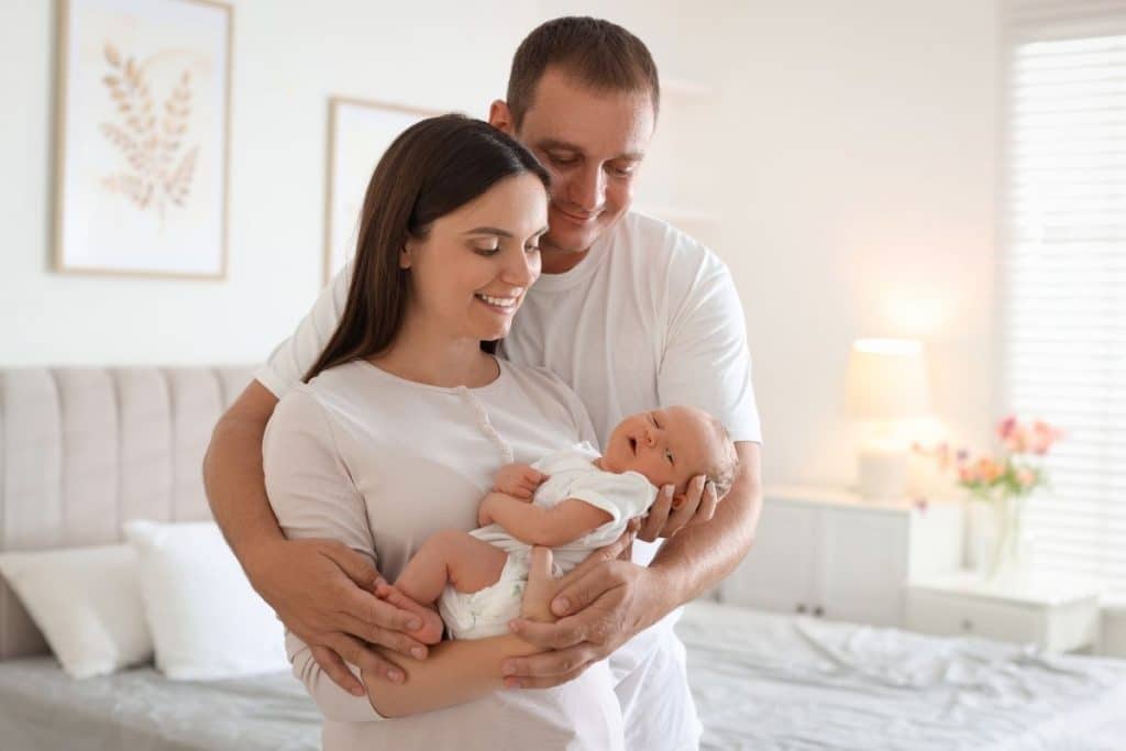 Rested parents bonding with their newborn after receiving professional care support