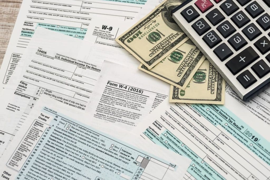 Household employment paperwork and tax forms for hiring a nanny