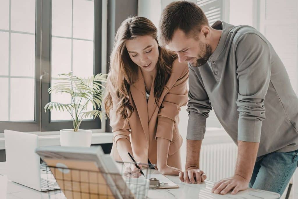 Parent and nanny reviewing a written nanny contract and job description