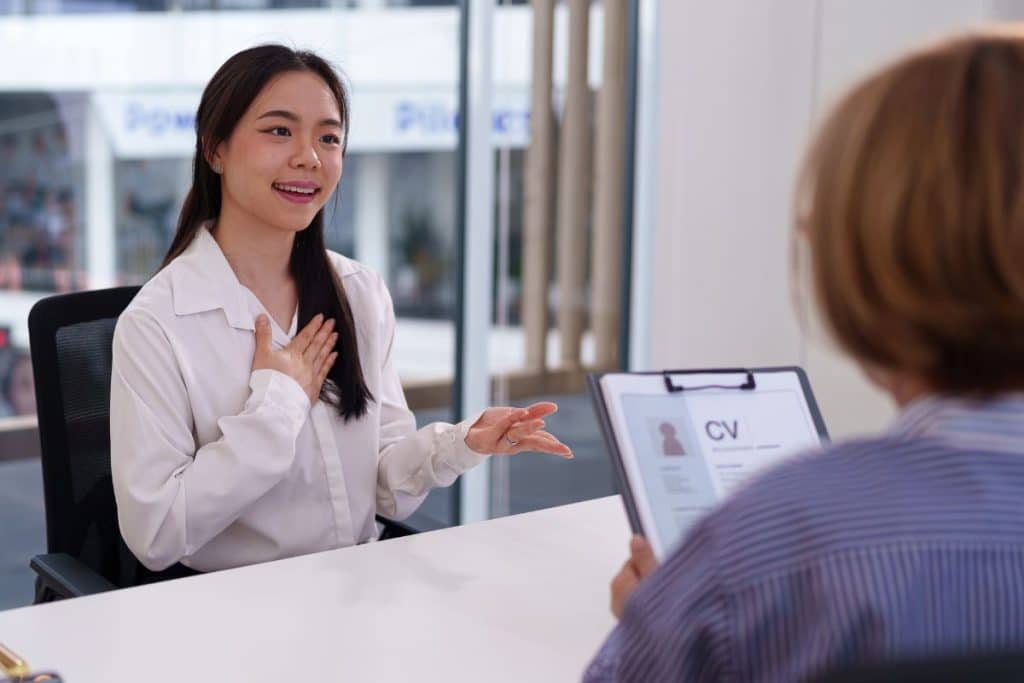 Nanny agency consultant interviewing a professional nanny candidate in a structured setting.