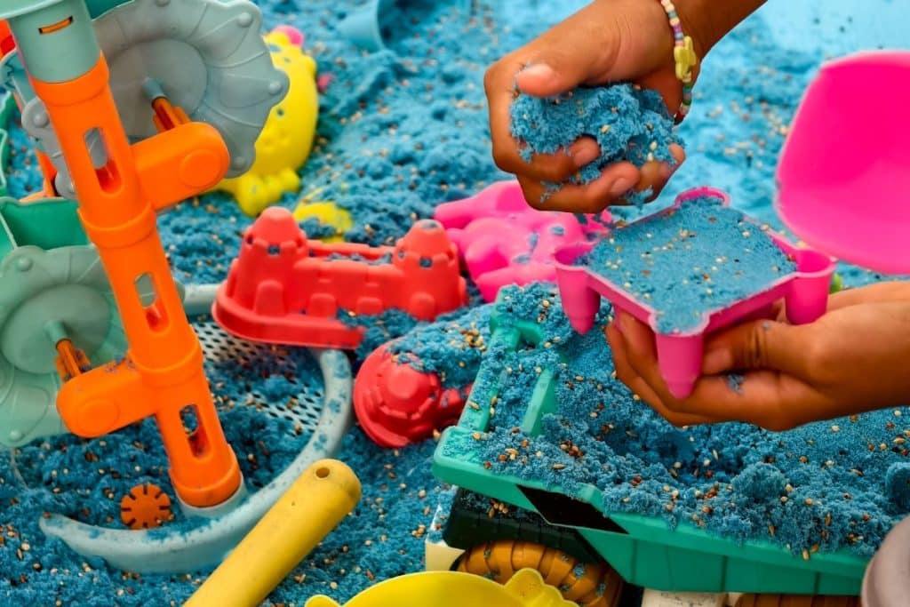 Professional nanny leading structured developmental play activity with children