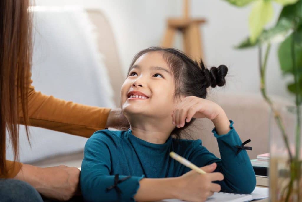 child happily engaged in routine activity with consistent nanny caregiver