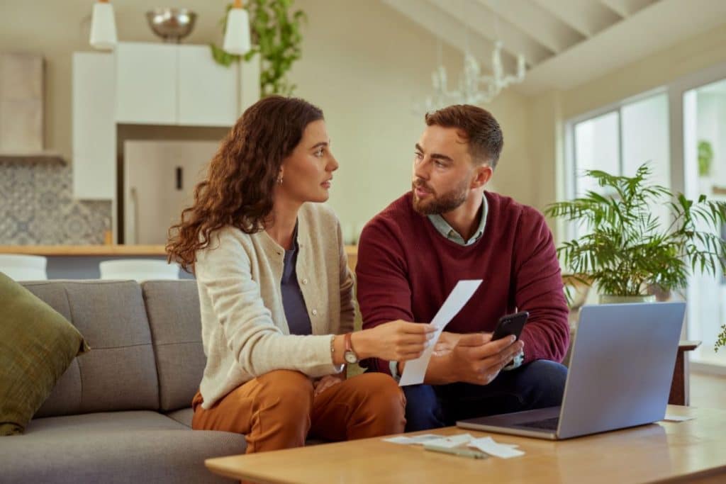 family discussing pay, contract, and expectations with nanny in home setting