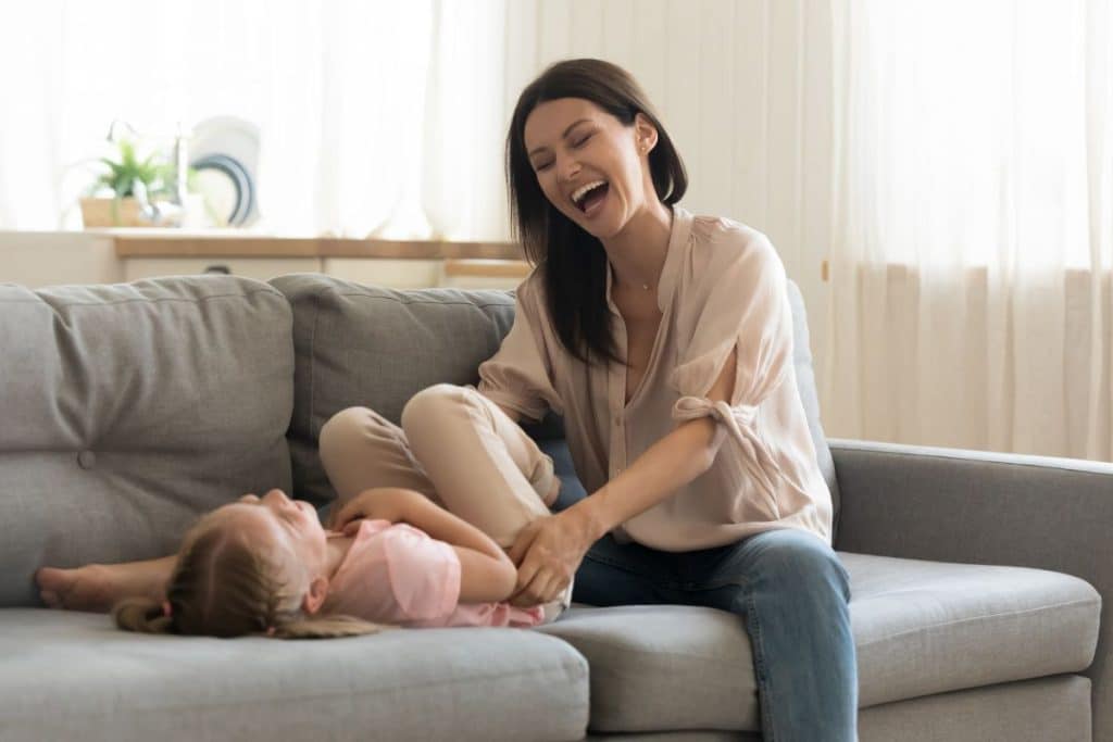 Child calm and happy with nanny in a peaceful home environment