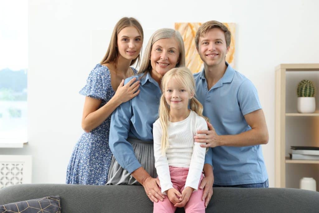 Happy family with nanny building long-term relationship and trust