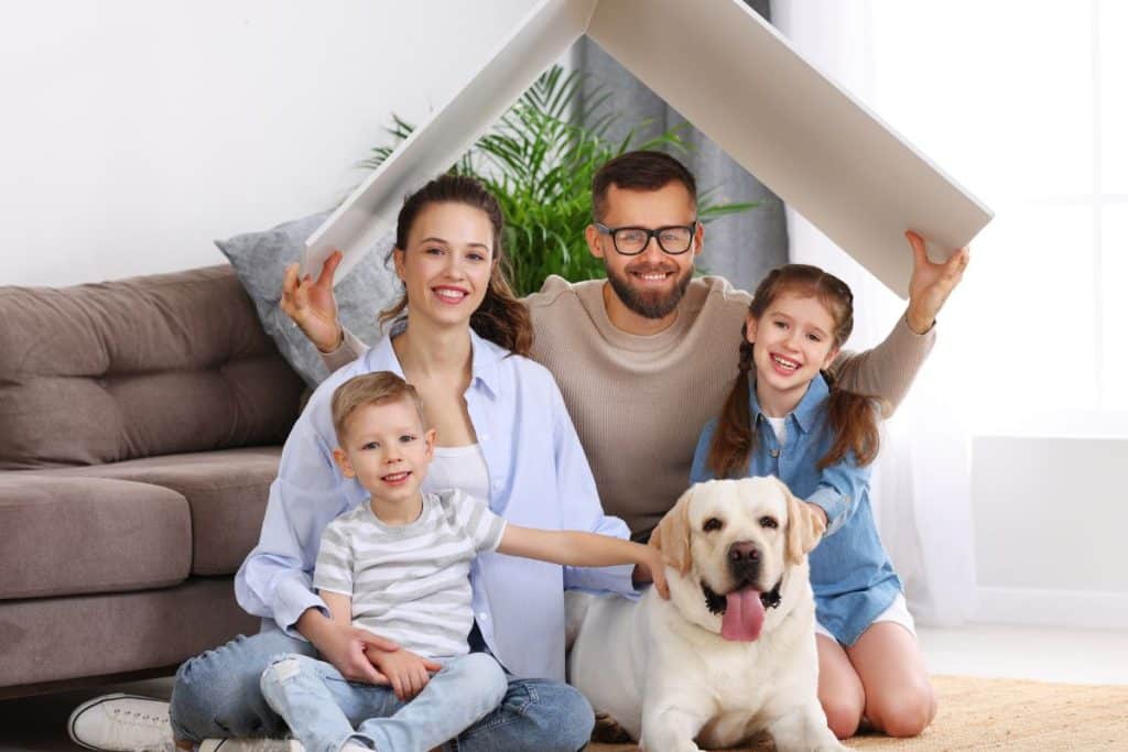 Happy family with nanny building trust and routine at home