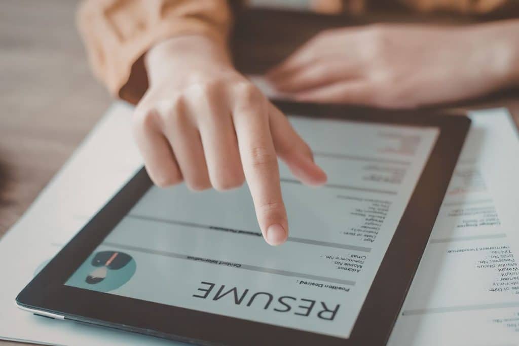 Recruiter reviewing nanny applications and conducting background checks on candidates