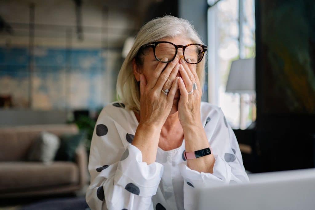 Overwhelmed parent reviewing applications versus calm guided nanny hiring process