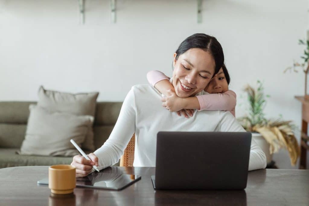 Busy working parent coordinating flexible childcare schedule with nanny