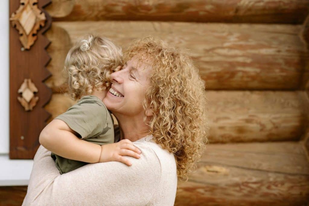 Nanny comforting child and responding with emotional awareness