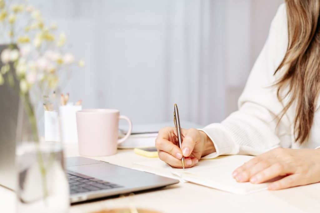 Parent creating childcare schedule and nanny responsibilities checklist