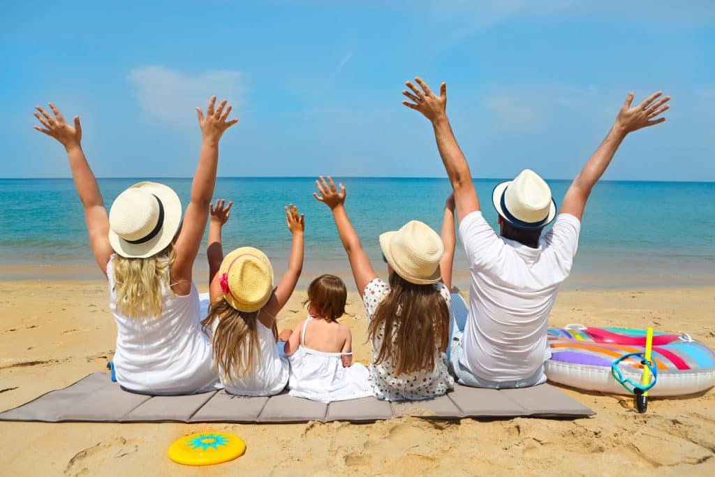 Family enjoying a stress-free vacation with professional travel nanny support.