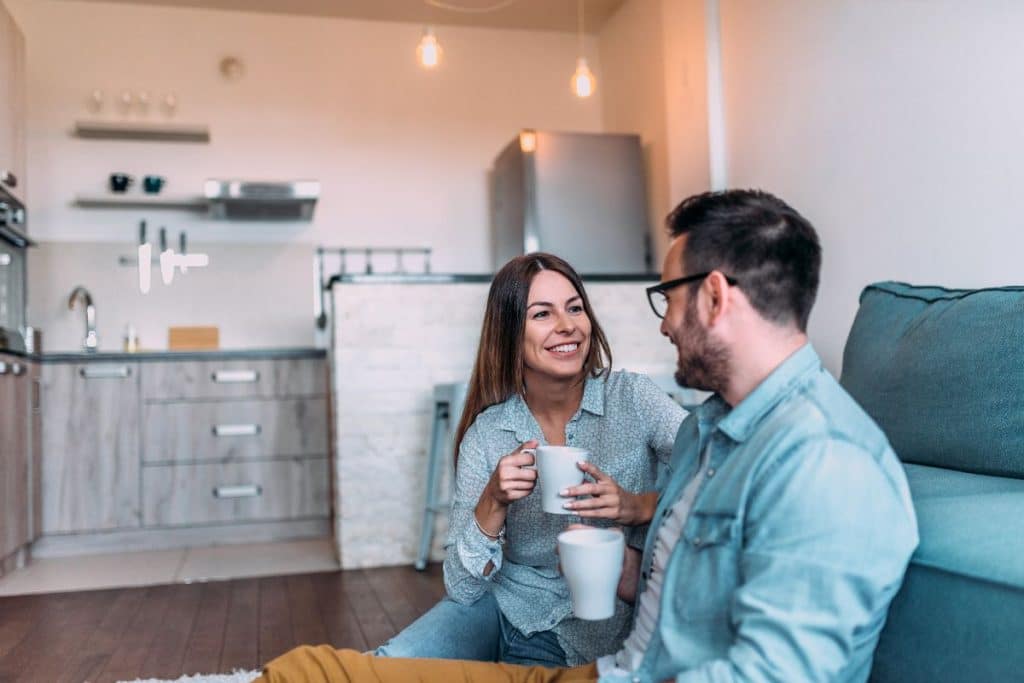 Parents comparing travel nanny and vacation babysitter options before a family trip.