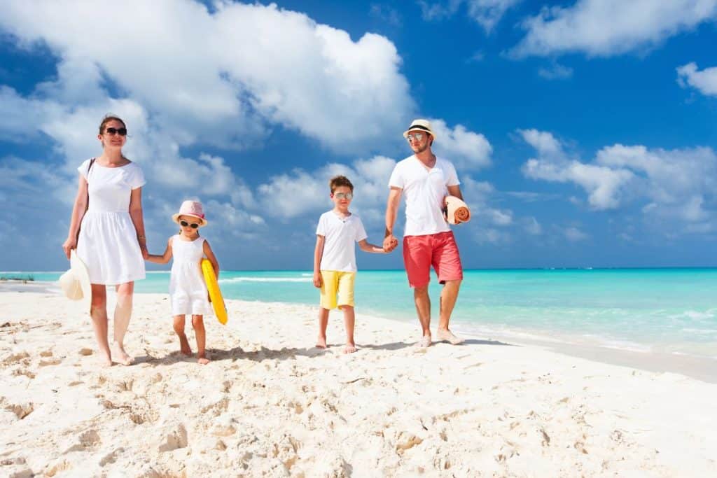 Family enjoying a successful vacation with support from a professional travel nanny.