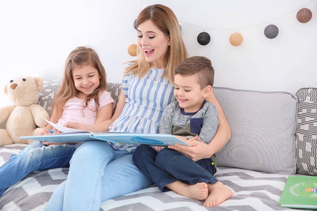 Nanny guiding children through educational summer learning activities and structured daily routines.