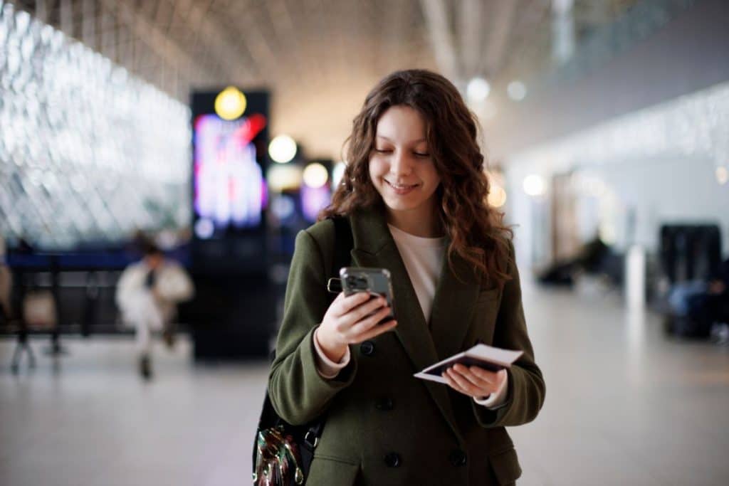 Travel nanny reviewing emergency procedures and travel safety information before a trip.