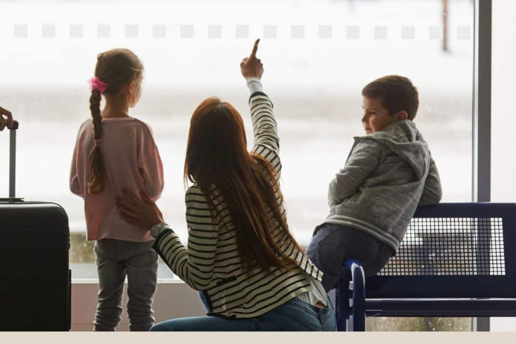 Professional travel nanny helping a family enjoy a stress-free summer vacation with children.