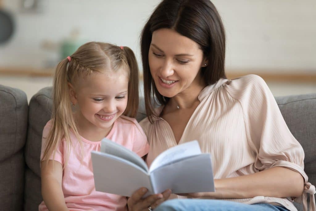 Family and nanny enjoying a strong long-term relationship built through fair compensation and professional benefits.