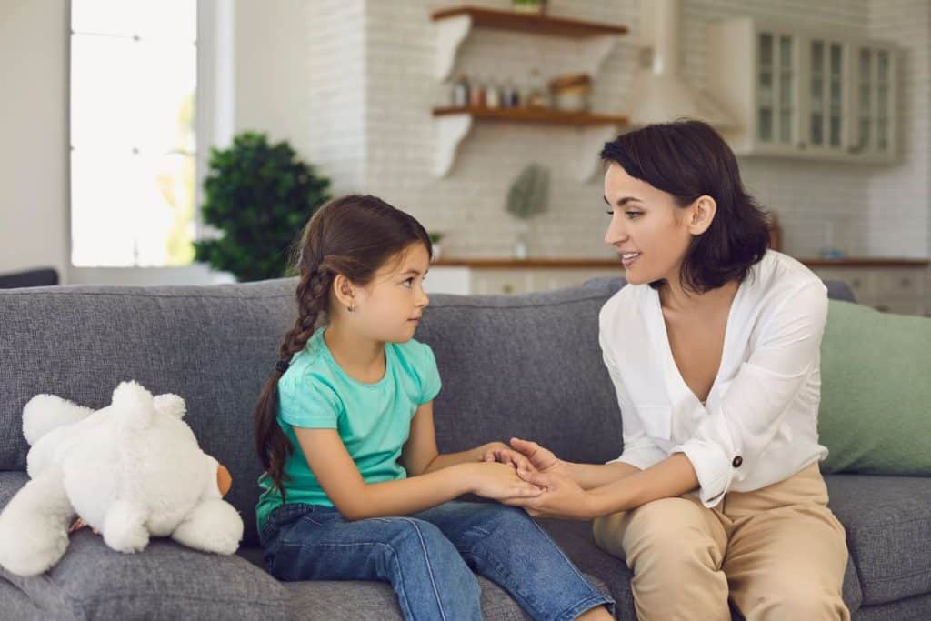 Professional nanny using communication and emotional intelligence with a child