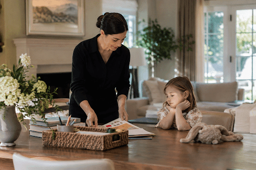 Professional nanny preparing a quiet enrichment activity for a child in a private home