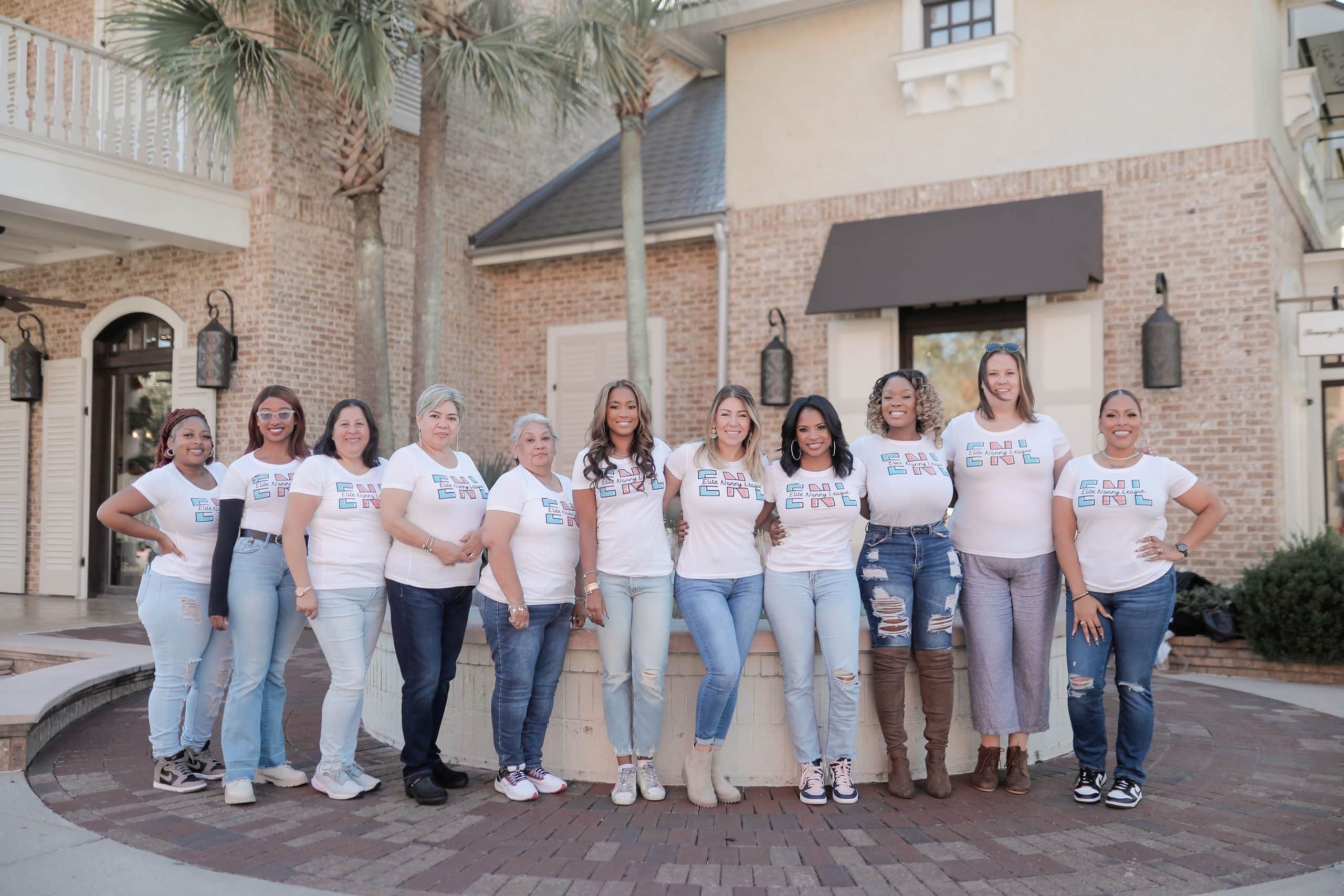 Group of professional nannies from Elite Nanny League standing outside an elegant home.